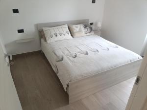 Postel nebo postele na pokoji v ubytování Cà De Qualì