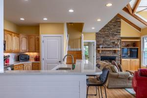 a kitchen with a large island in a room at Echota Ridge Boulders in Banner Elk