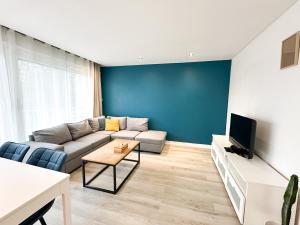 Μια τηλεόραση ή/και κέντρο ψυχαγωγίας στο Appartement lumineux avec balcon Parking privé