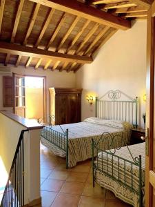 Ένα ή περισσότερα κρεβάτια σε δωμάτιο στο Dimora Le Galere - Pool & Relax