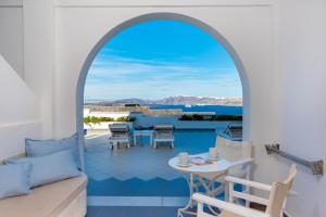a view from the living room of a villa at Acrothea Suites and Villas - Akrotiri Caldera - Santorini in Akrotiri