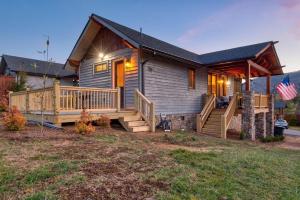 a home with a large porch and a deck at Banner Bear in Banner Elk