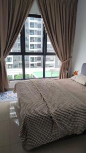 Ένα ή περισσότερα κρεβάτια σε δωμάτιο στο Das Haus Homestay Puchong