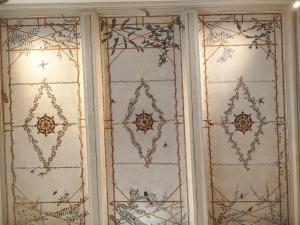 a pair of glass doors with patterns on them at A Casa di Mavina - Luxury Stay in Siena