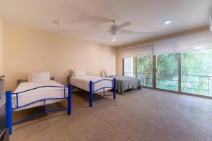 Ένα ή περισσότερα κρεβάτια σε δωμάτιο στο 2029 - Villa Camino Real +34 φωτογραφίες