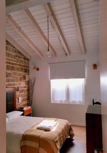 Ένα ή περισσότερα κρεβάτια σε δωμάτιο στο Casa Rural Lorehonea