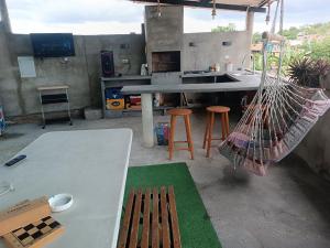 a kitchen with a hammock and a table and chairs at Mini apartamento 2 habitaciones in Ciudad Guayana