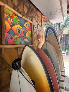 a group of surfboards lined up against a wall at Marumar in Popoyo
