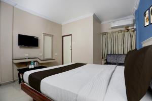 Voodi või voodid majutusasutuse Hotel O ANNAPURNA RESIDENCY toas