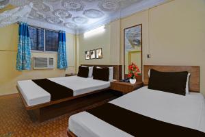 Ένα ή περισσότερα κρεβάτια σε δωμάτιο στο Hotel O Down Town Hotel