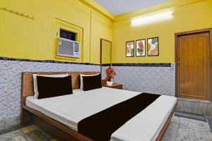 Ένα ή περισσότερα κρεβάτια σε δωμάτιο στο Hotel O Down Town Hotel +21 φωτογραφίες