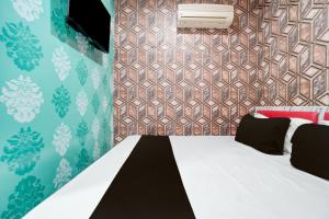 Ένα ή περισσότερα κρεβάτια σε δωμάτιο στο Hotel O Unique Stay Inn +22 φωτογραφίες