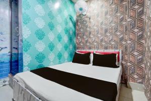 Ένα ή περισσότερα κρεβάτια σε δωμάτιο στο Hotel O Unique Stay Inn