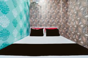 Ένα ή περισσότερα κρεβάτια σε δωμάτιο στο Hotel O Unique Stay Inn