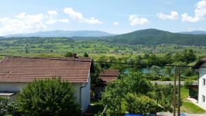 a view of a valley with mountains in the distance at Apartment Beha in Bihać
