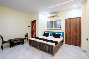 Ένα ή περισσότερα κρεβάτια σε δωμάτιο στο HOTEL O KPS INN