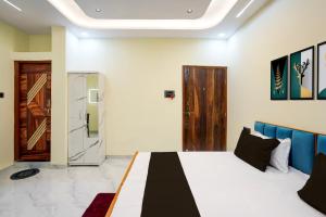 Ένα ή περισσότερα κρεβάτια σε δωμάτιο στο HOTEL O KPS INN