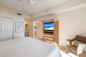 Ένα ή περισσότερα κρεβάτια σε δωμάτιο στο The Beach Club 107D +49 φωτογραφίες