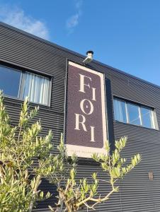 a sign on the side of a building at Fiori private wellness en hotel in Lier
