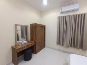 Ένα ή περισσότερα κρεβάτια σε δωμάτιο στο روعة أجا للشقق المخدومة