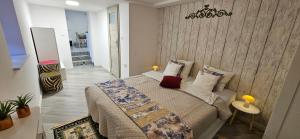 a bedroom with a large bed in a room at Willa Joanna in Gdańsk