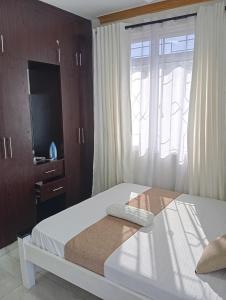 Ένα ή περισσότερα κρεβάτια σε δωμάτιο στο floriancy Homes