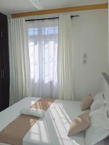 Ένα ή περισσότερα κρεβάτια σε δωμάτιο στο floriancy Homes