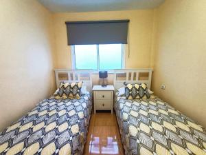 Ένα ή περισσότερα κρεβάτια σε δωμάτιο στο Miramar 4