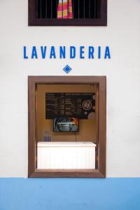 a sign for a hawaiian restaurant on the side of a building at VO´E in San Cristóbal de Las Casas