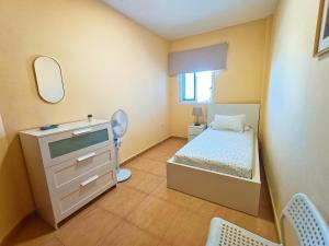 Ένα ή περισσότερα κρεβάτια σε δωμάτιο στο Miramar 11