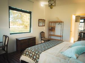 Ένα ή περισσότερα κρεβάτια σε δωμάτιο στο Casa de Campo San Agustín