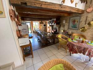 a kitchen and dining room with a table and chairs at Hôtel restaurant de la fontaine in Villiers-sur-Suize +23 photos
