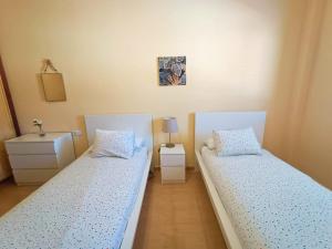 Ένα ή περισσότερα κρεβάτια σε δωμάτιο στο Miramar 9