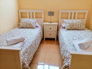 Ένα ή περισσότερα κρεβάτια σε δωμάτιο στο Miramar 3