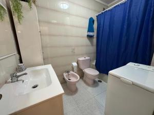 a bathroom with a sink and a toilet and a shower at Casa Cabana in El Médano