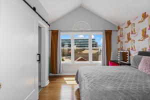 a bedroom with a bed and a window at The Fancy Nancy in Nashville