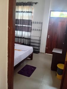 Postel nebo postele na pokoji v ubytování Swarnavilla Yala