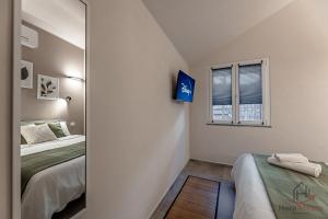 Ένα ή περισσότερα κρεβάτια σε δωμάτιο στο Alta Via 2 - Free Parking - Sea 20 min - A-C