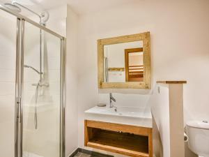 a bathroom with a sink and a mirror at Chalet 3 chambres - Sauna et salle de sport - 8 pers - FR-1-685-91 in Les Gets +11 photos