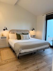 Ένα ή περισσότερα κρεβάτια σε δωμάτιο στο Apartamentos Campo Mingo