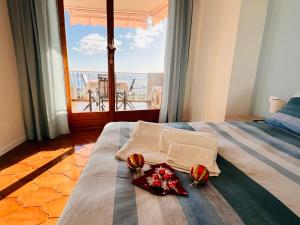 Ένα ή περισσότερα κρεβάτια σε δωμάτιο στο Bilocale VISTA MARE e Parcheggio privato