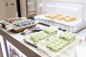 a buffet filled with lots of different types of food at Hotel Dona Sofia in Braga