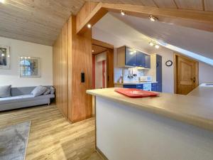 a kitchen with a counter and a living room at Riedenburg I in Buch