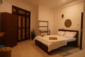 Ένα ή περισσότερα κρεβάτια σε δωμάτιο στο Three Elements