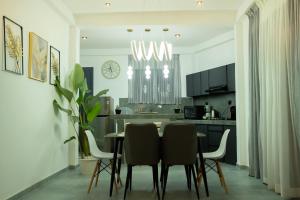 a kitchen and dining room with a table and chairs at Villa EN 22 in Galle