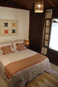 Ένα ή περισσότερα κρεβάτια σε δωμάτιο στο Chalé Oxossi