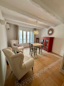 a living room with two chairs and a table at old town Charming retreat with sunny terrace in Marbella