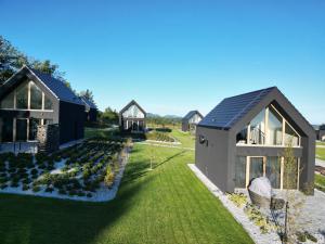 a rendering of a house with a garden at Górskie Kąty Resort Michałkowa in Michałkowa