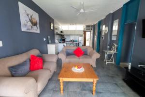 a living room with two couches and a coffee table at Seagull Apartment -2 Bedroom Apartment 408 by First Private Stays in Margate