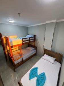 a small room with two bunk beds in it at Gamandy Hostel in Luxor